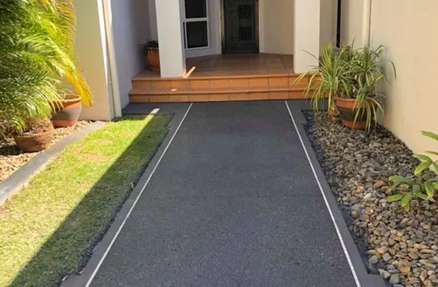 Charcoal exposed aggregate path leading to a front entry