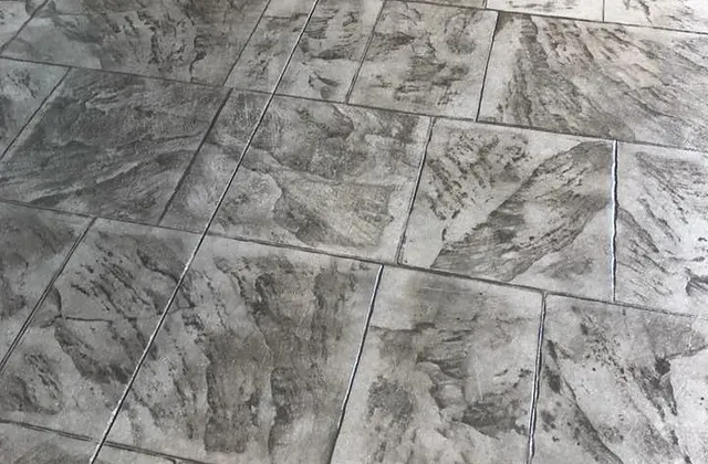 Stamped concrete in a grey slate flagstone pattern