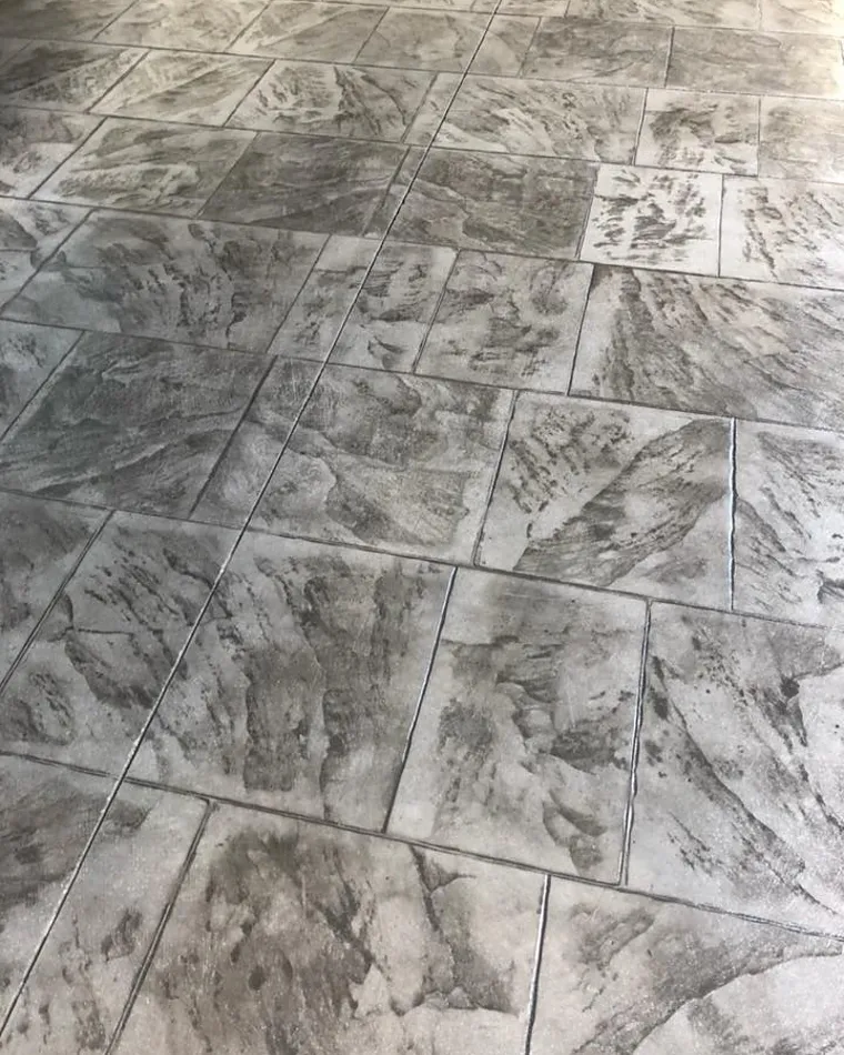 Stamped concrete in a grey slate flagstone pattern