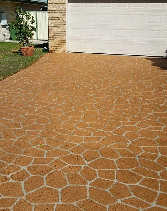 Terracotta stencilled driveway in a random flagstone pattern