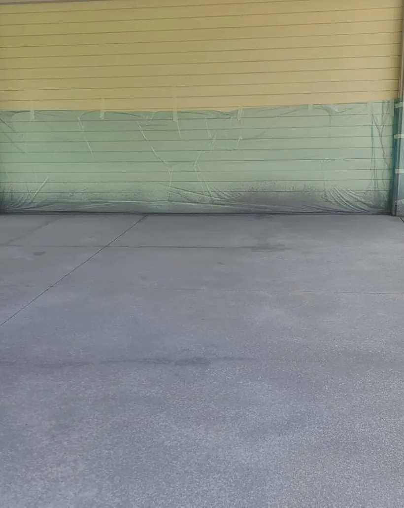 Plain concrete driveway with clean saw-cut control joints